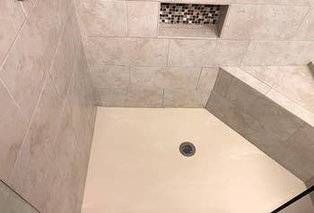 after image of the same shower completely clean
