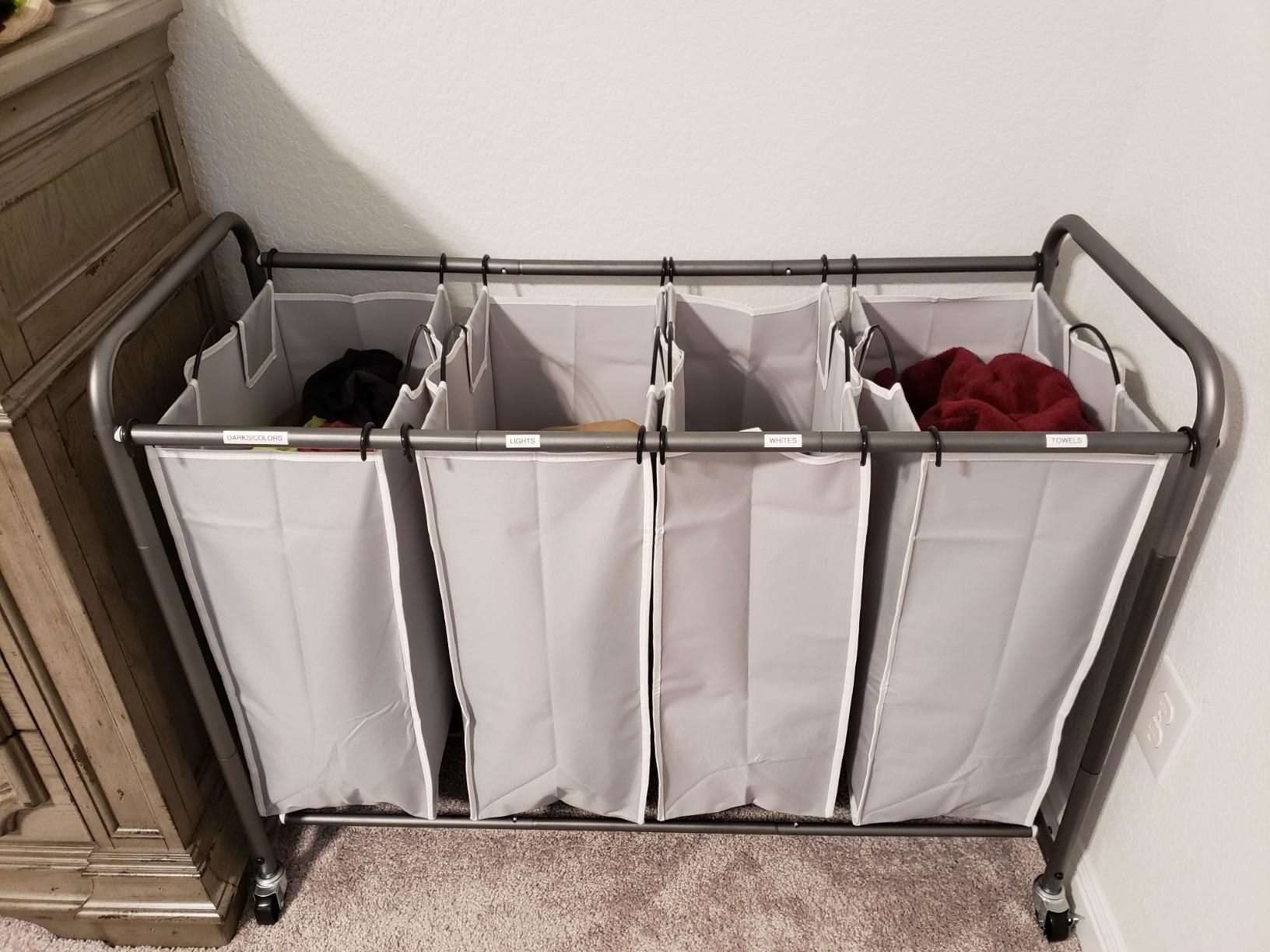 the gray organizer with clothes in each of the four bags