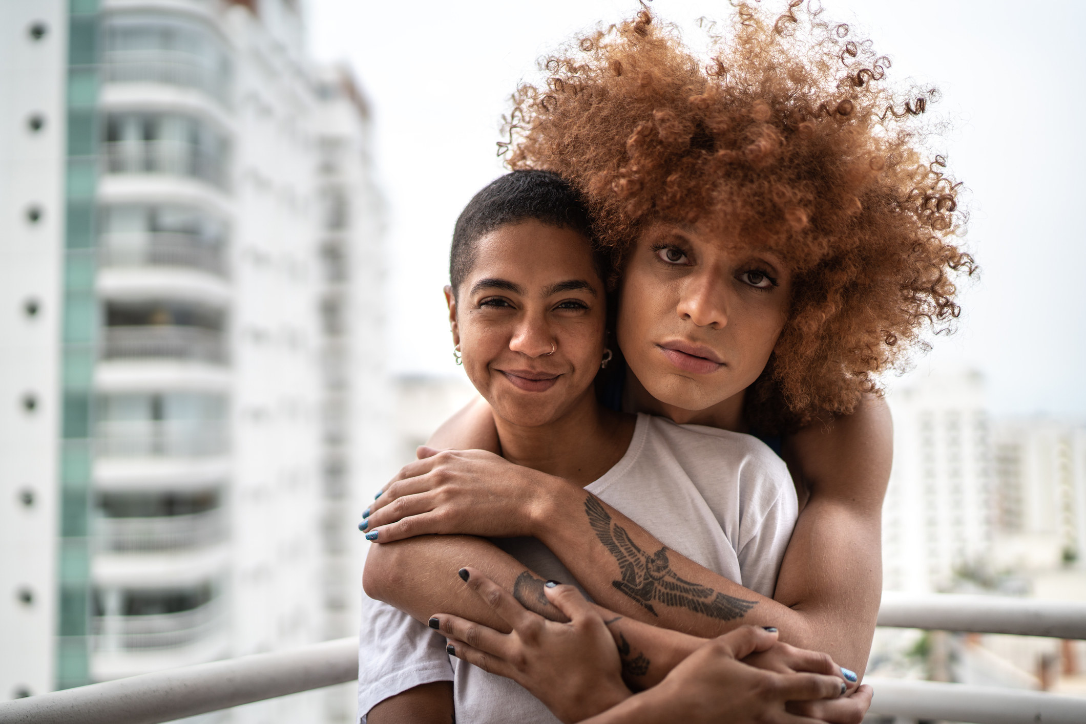 Portrait of a happy femme-presenting homosexual couple