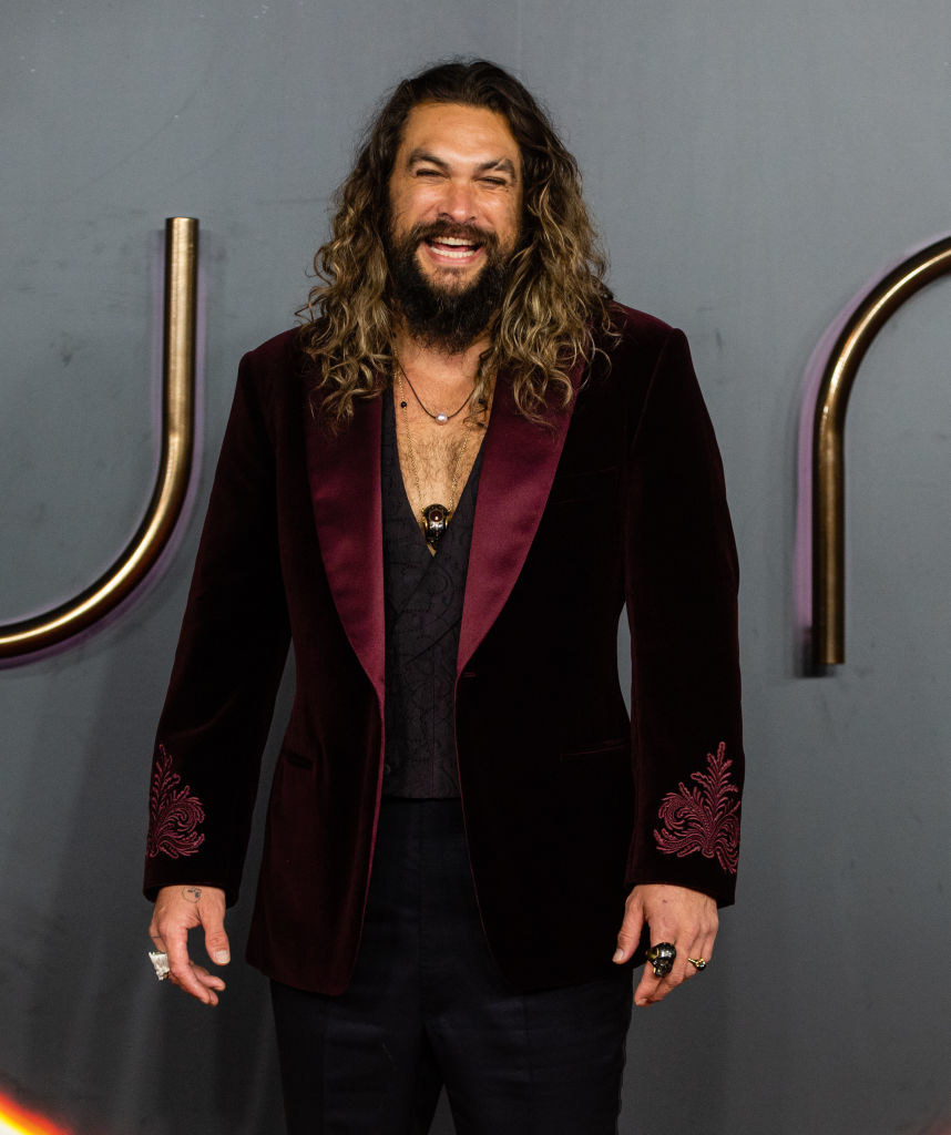 Momoa smiling on the red carpet