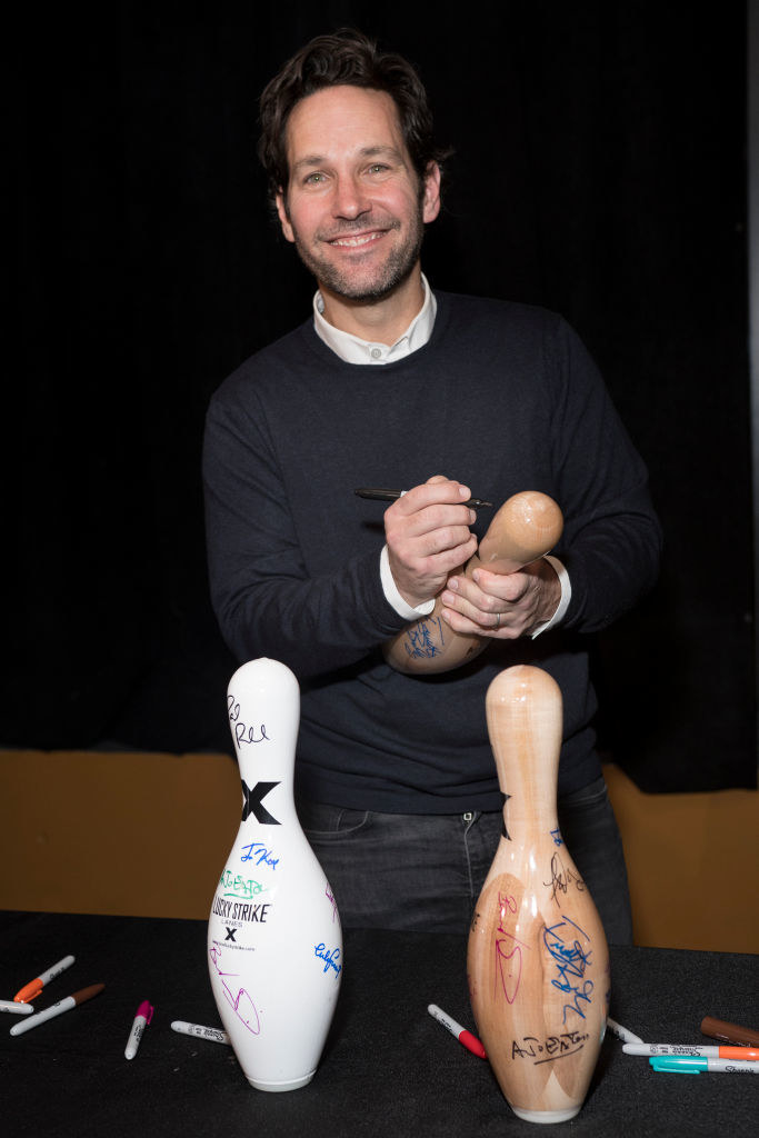 Paul signing bowling pins