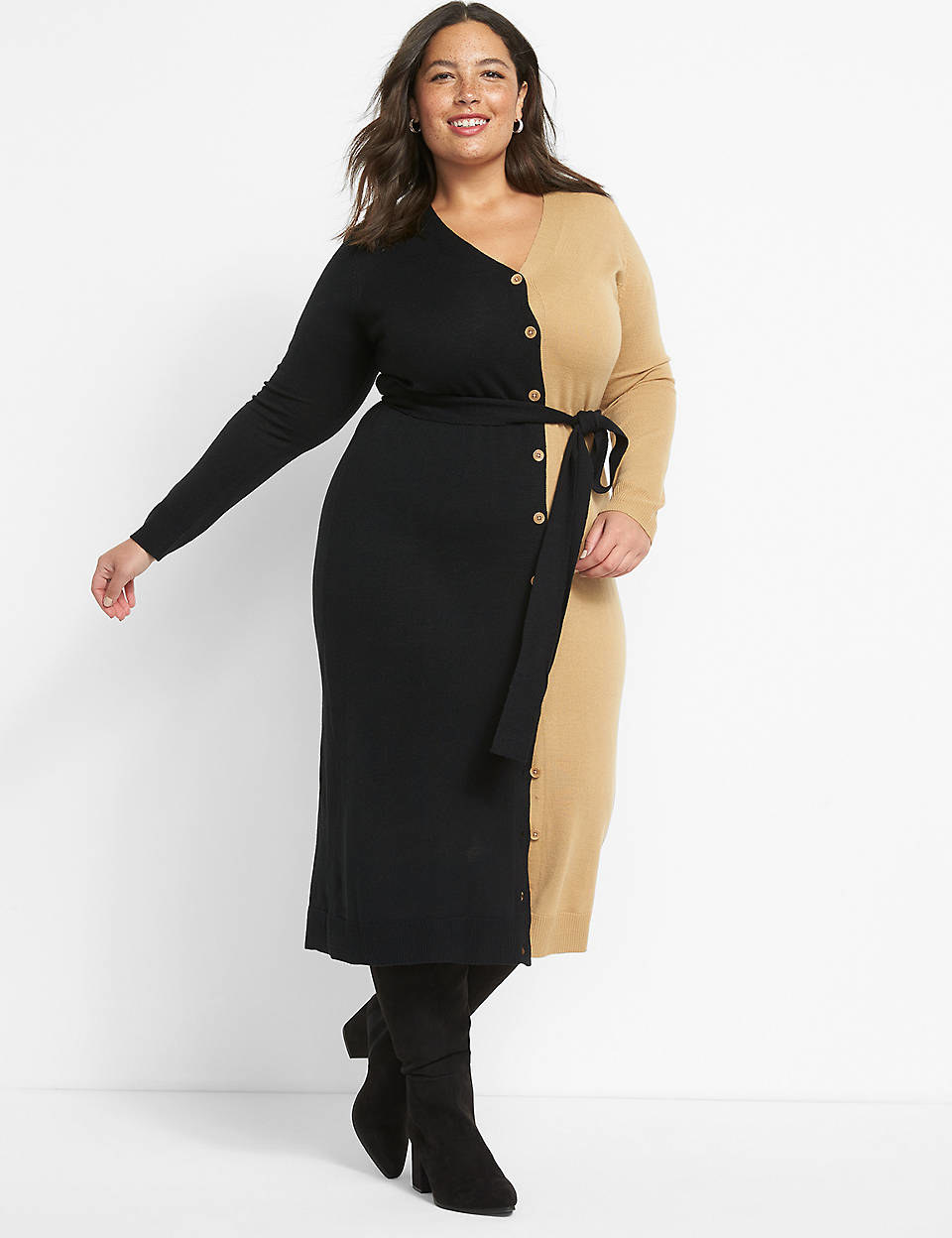 model in belted button front long sleeve dress that&#x27;s black on one side and tan on the other