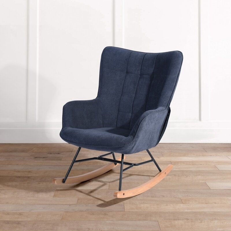 the blue padded chair with wooden rockers
