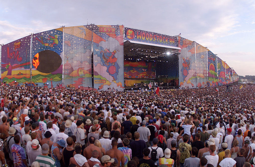 A huge crowd of people in front of a stage for Woodstock &#x27;99