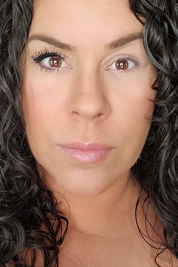 a reviewer photo showing the significant difference between one eye with the mascara and the other without