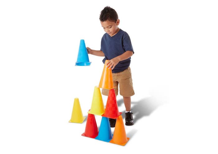 Kid playing with activity cones