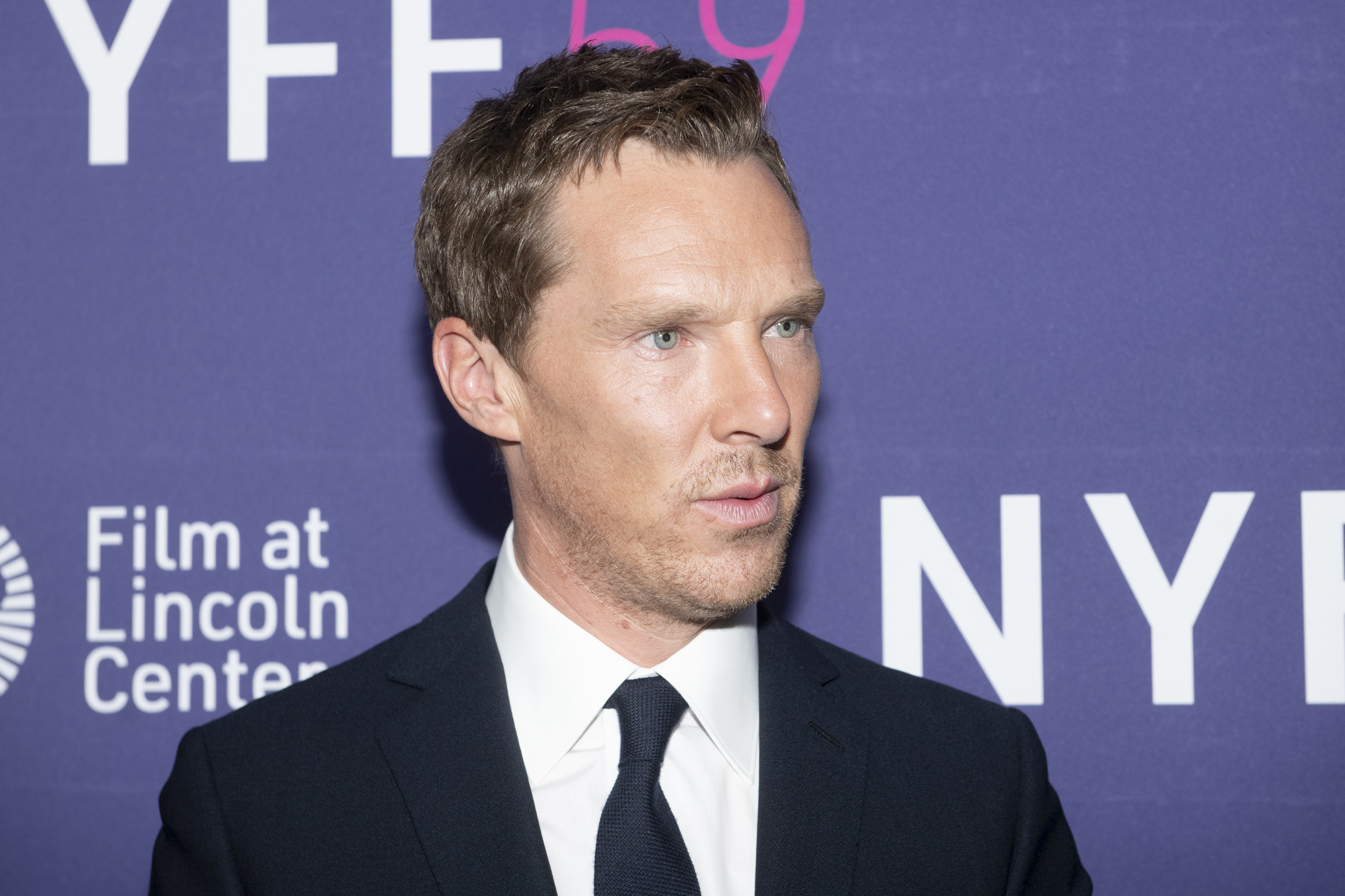 Cumberbatch looks off-camera at an event