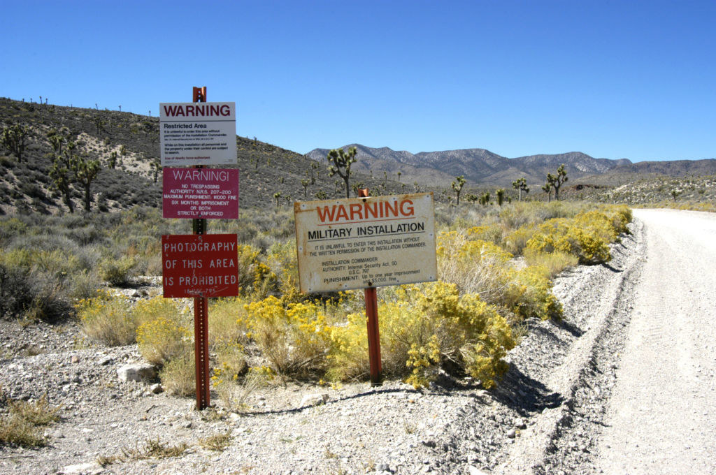 A deserted Area 51 in Nevada with military warning signs