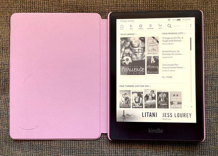 the Kindle in a pink folding case