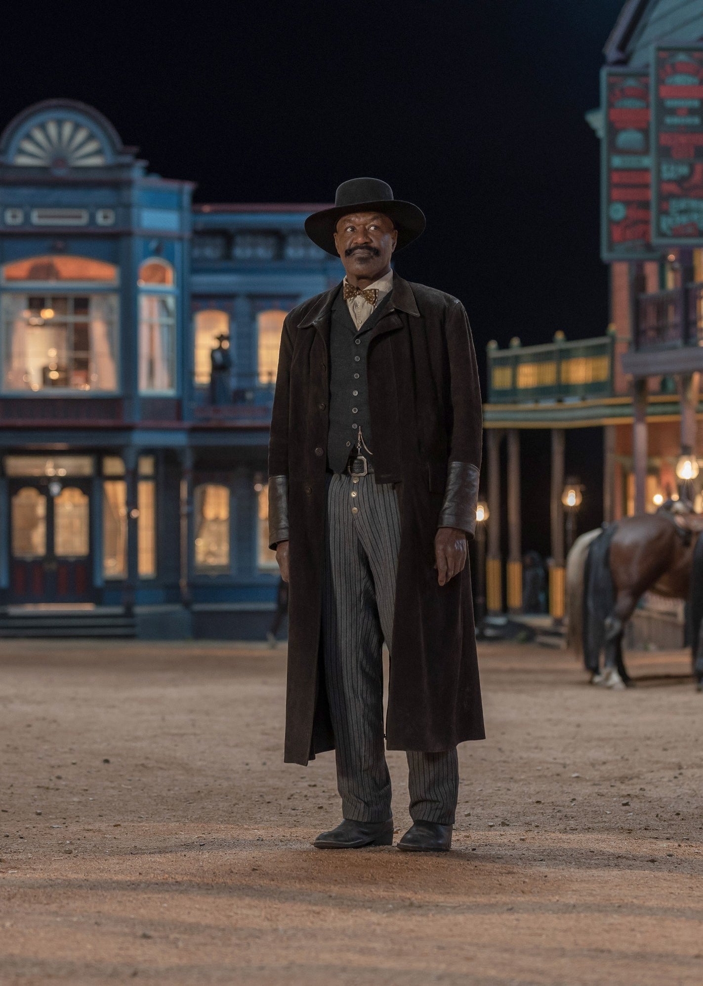 Delroy Lindo as Bass Reeves stands in a townsquare