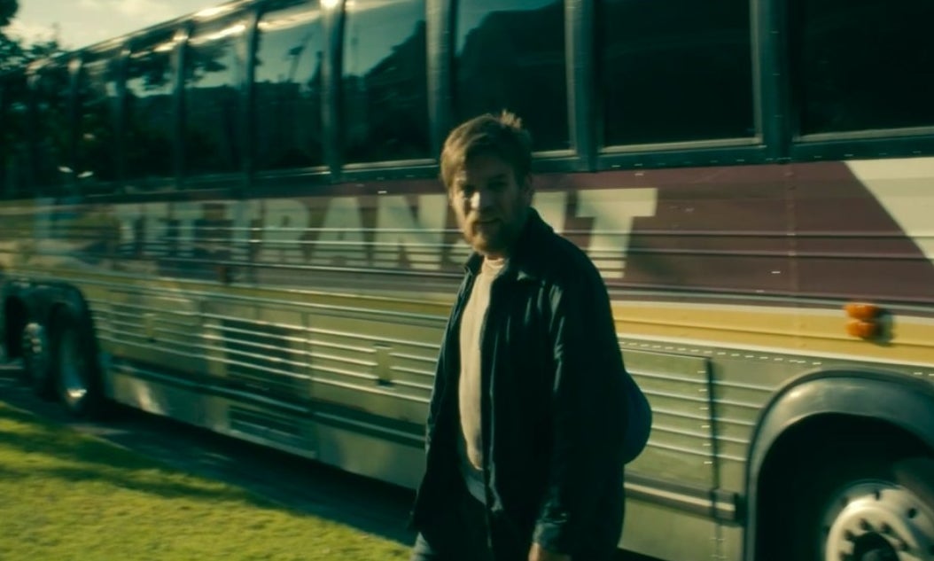 Dan walking in front of a Tet Transit bus in &quot;Doctor Sleep&quot;