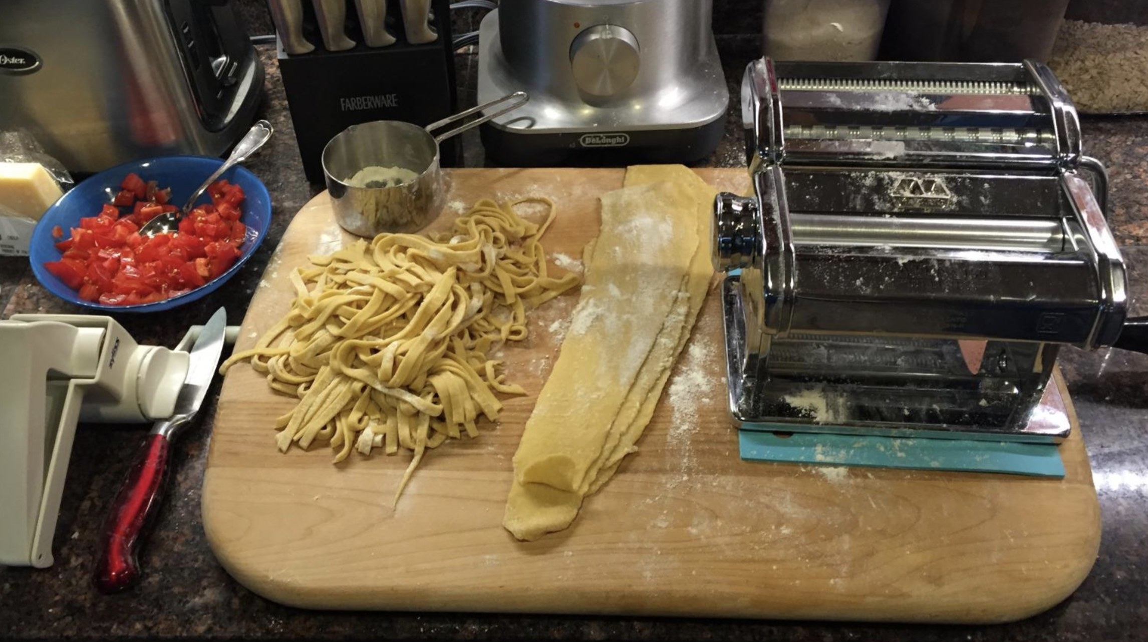 the pasta machine next to fresh made pasta