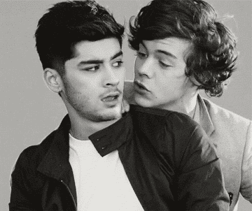 A clip from &quot;Kiss You&quot; music video. Harry kissing Zayn on the cheeks