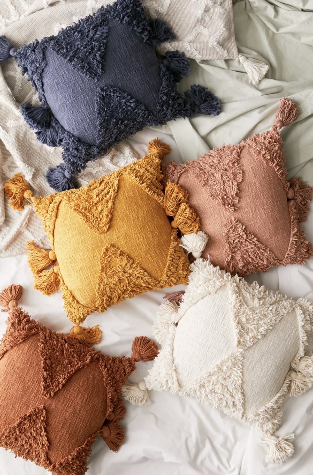 five of the pillows in various colors