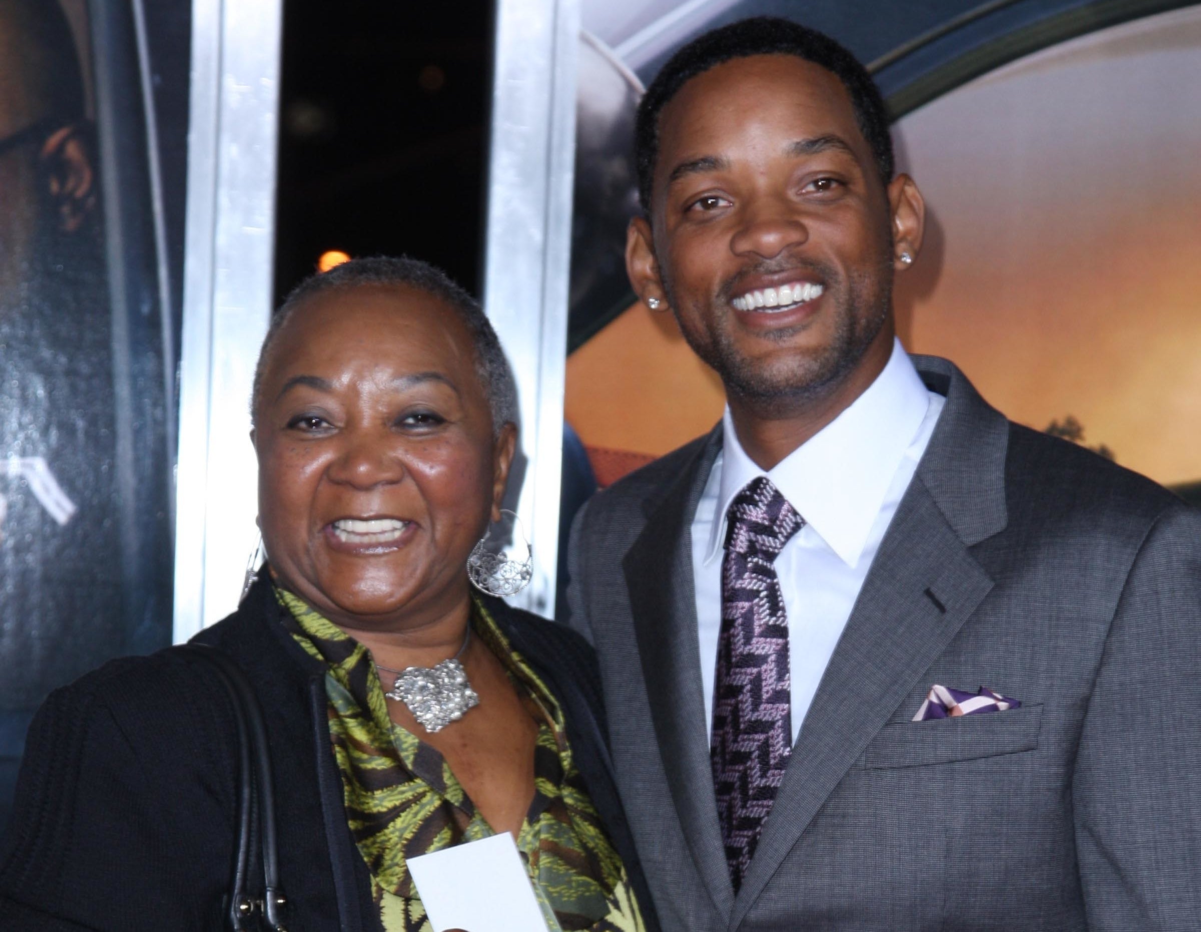 Will poses with his mother at an event