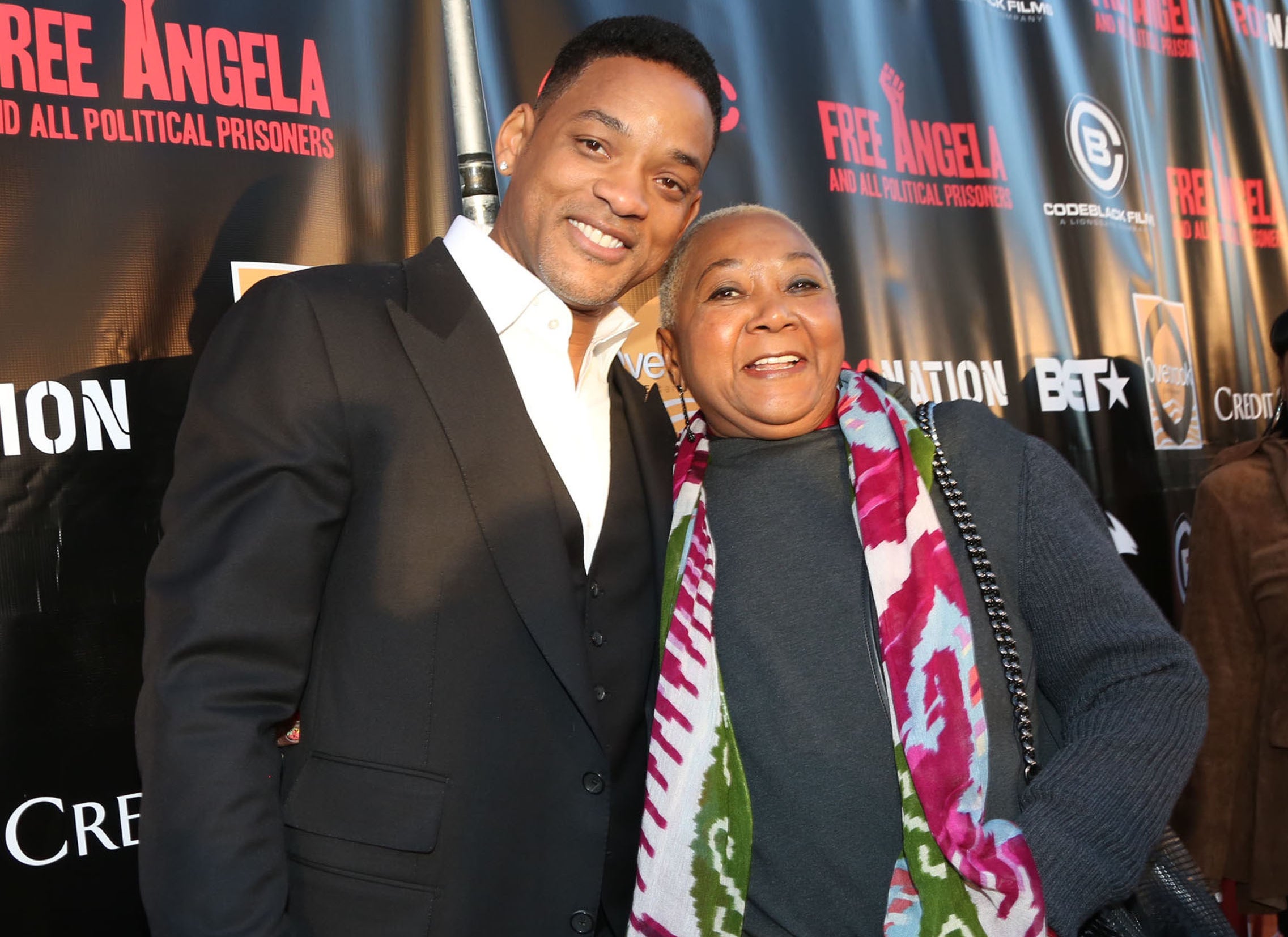 Will poses with his mother at an event