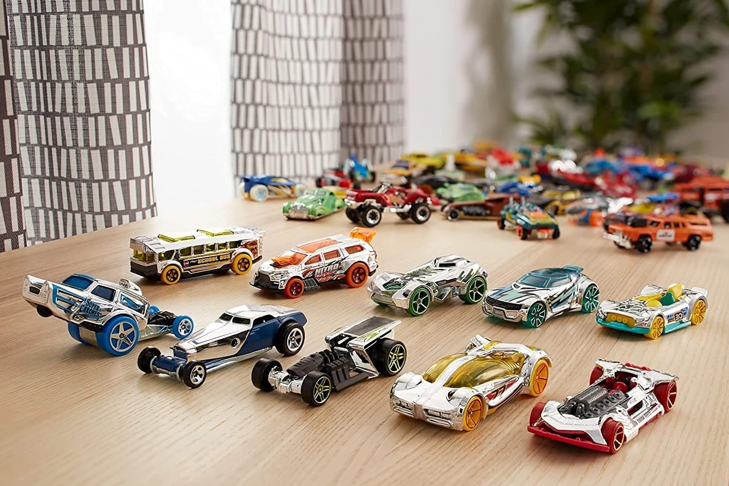 A collection of Hot Wheels cars on a table