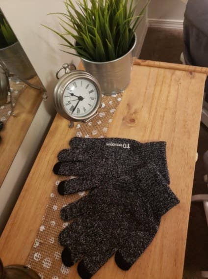 A reviewer&#x27;s image of a pair of a anti-slip winter gloves