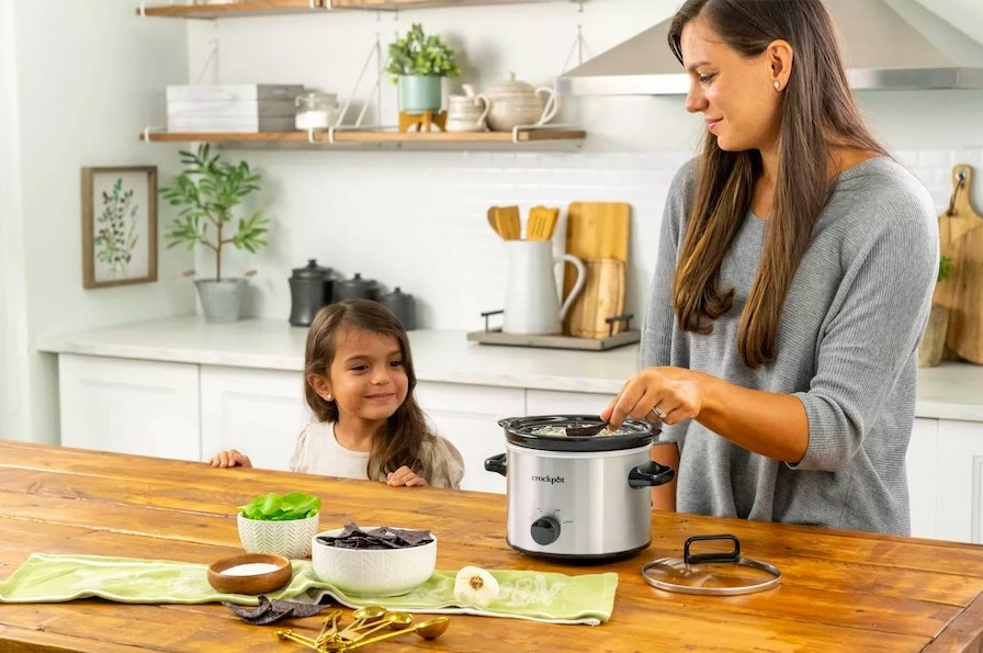 Models with Crock-Pot in a kitchen