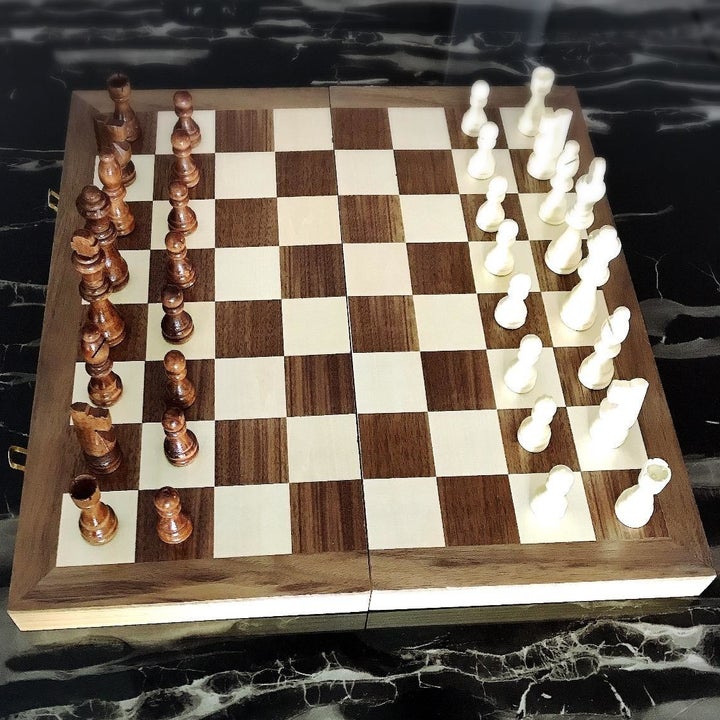 Reviewer image of wooden chess set with pieces set up