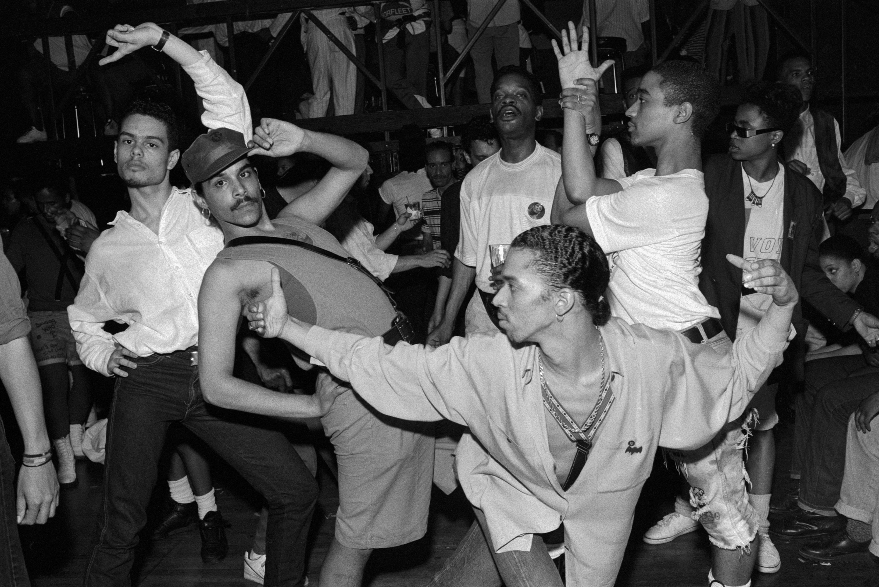 Black-and-white photo of people in various dramatic poses