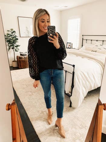 reviewer wears blouse with lace sleeves