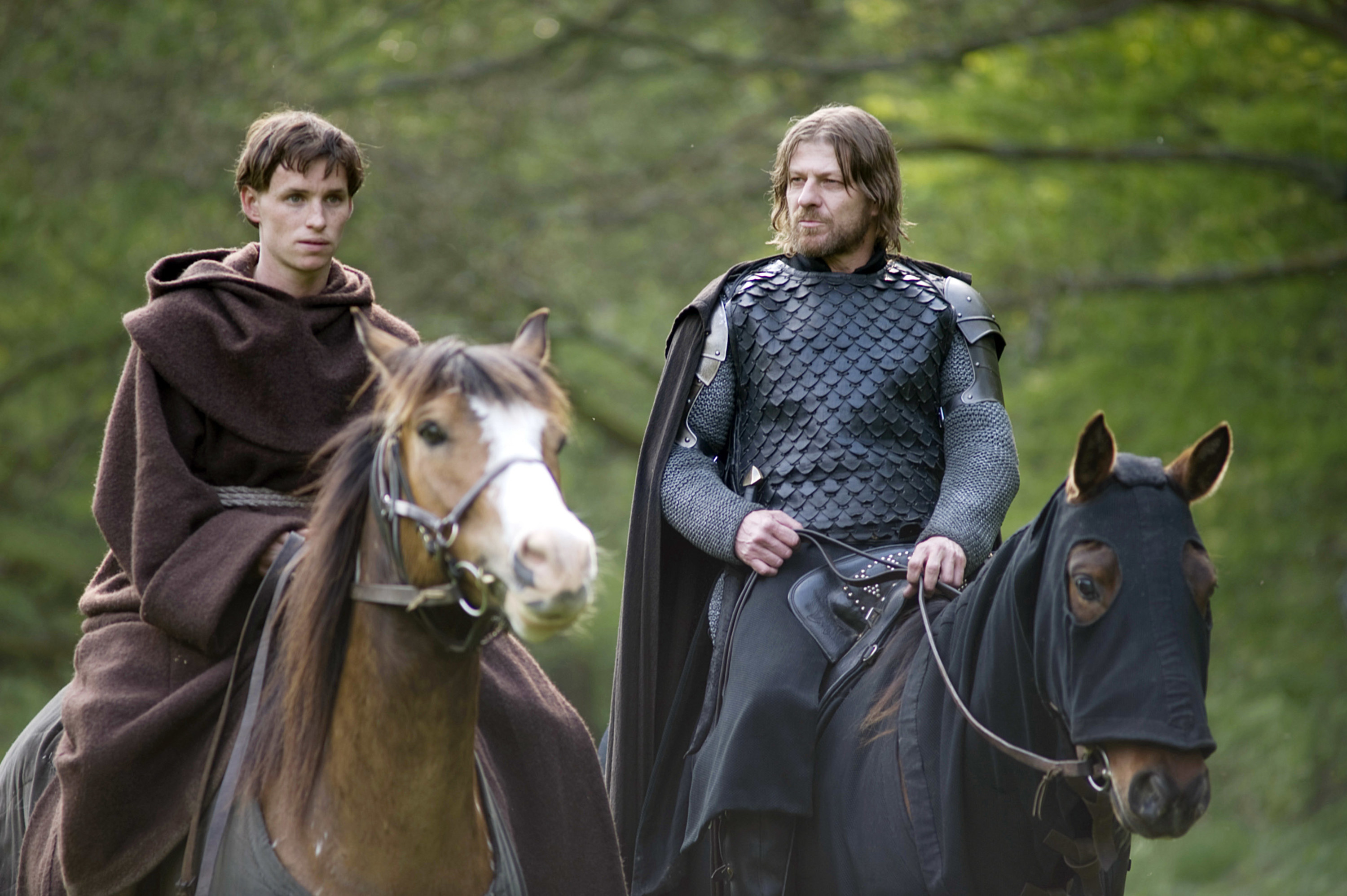 Eddie Redmayne on horseback next to Sean bean