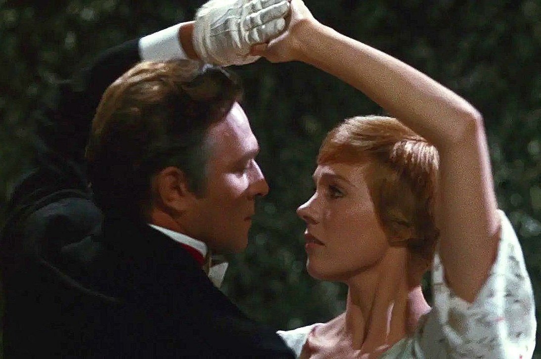 Captain von Trapp and Maria staring into each other&#x27;s eyes