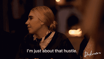 a gif of Luisa May Alcott in Dickinson saying &quot;I&#x27;m just about that hustle&quot;