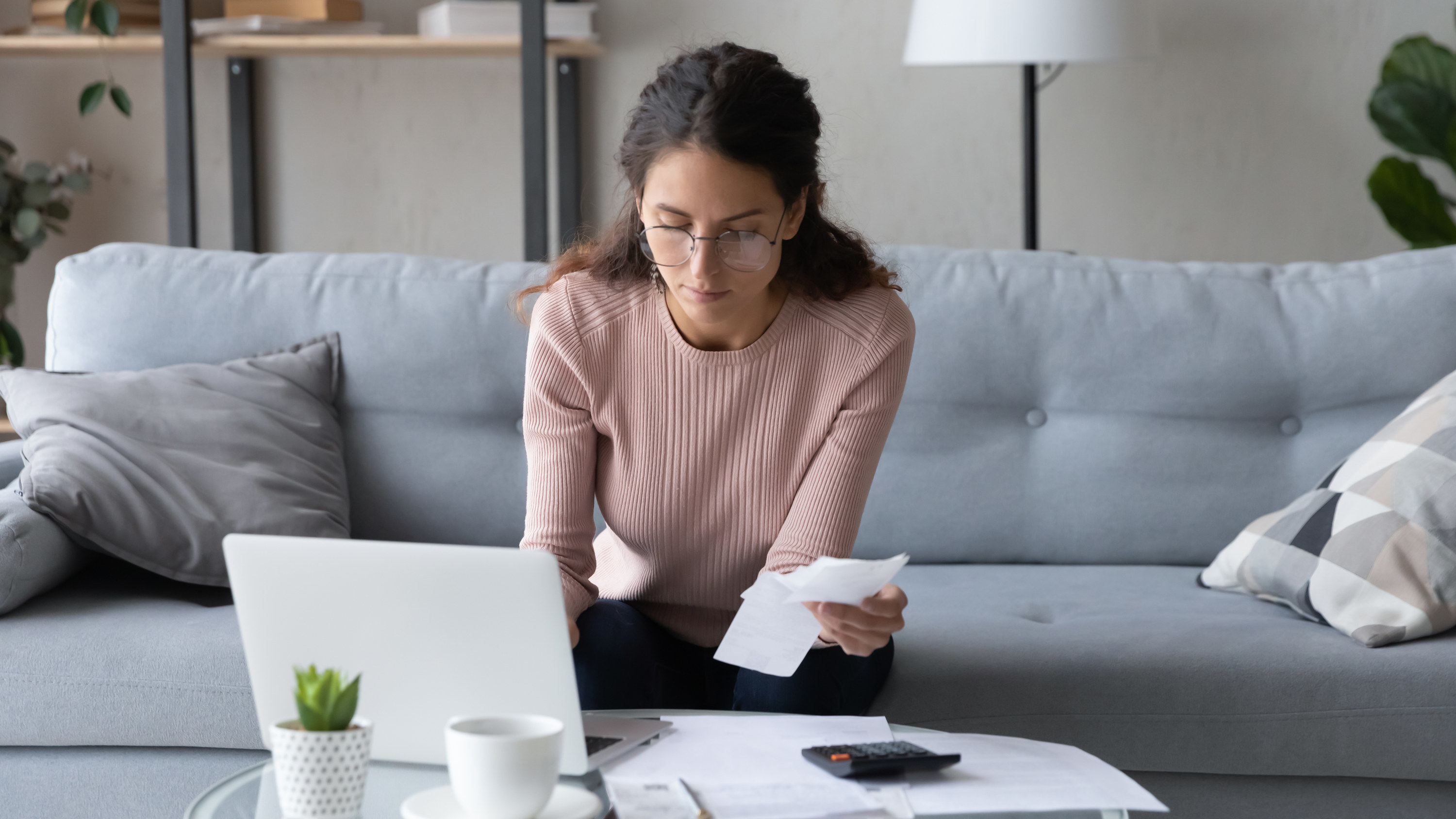 Woman paying bills on her computer