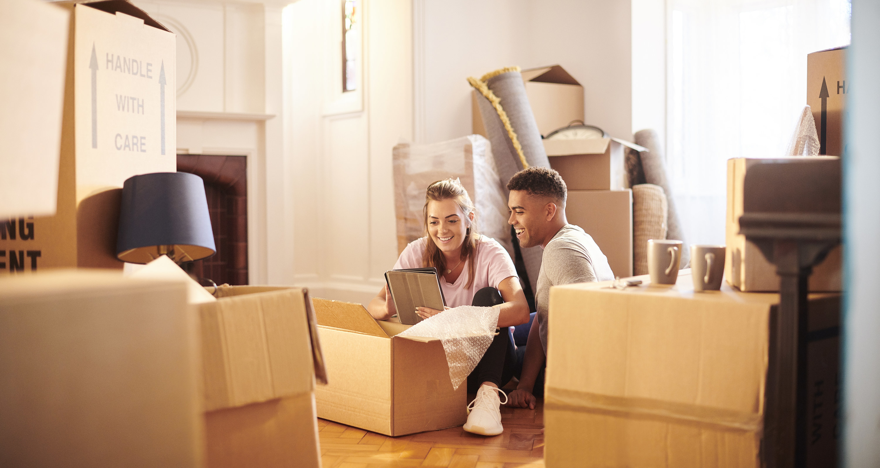 Couple unpacking boxes in a new place