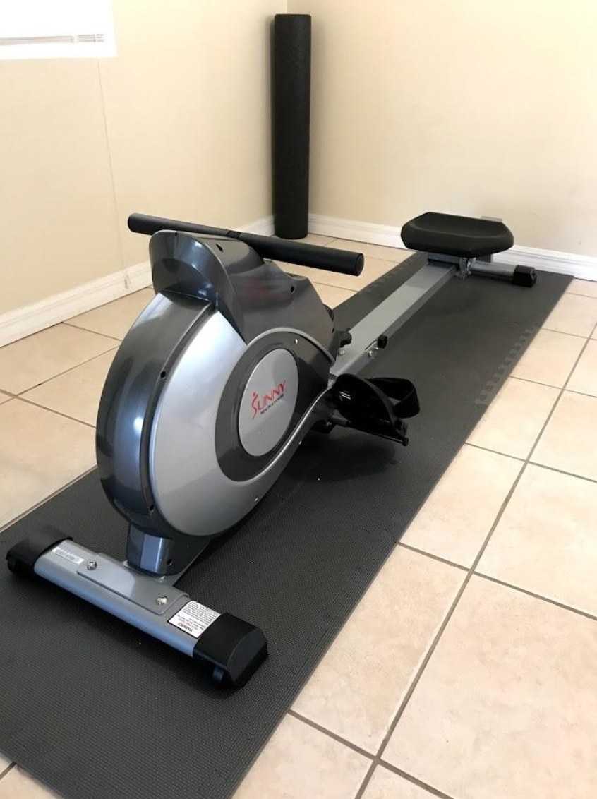 Reviewer&#x27;s black and gray rowing machine