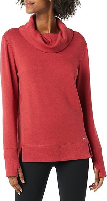 a model wearing the sweatshirt in red