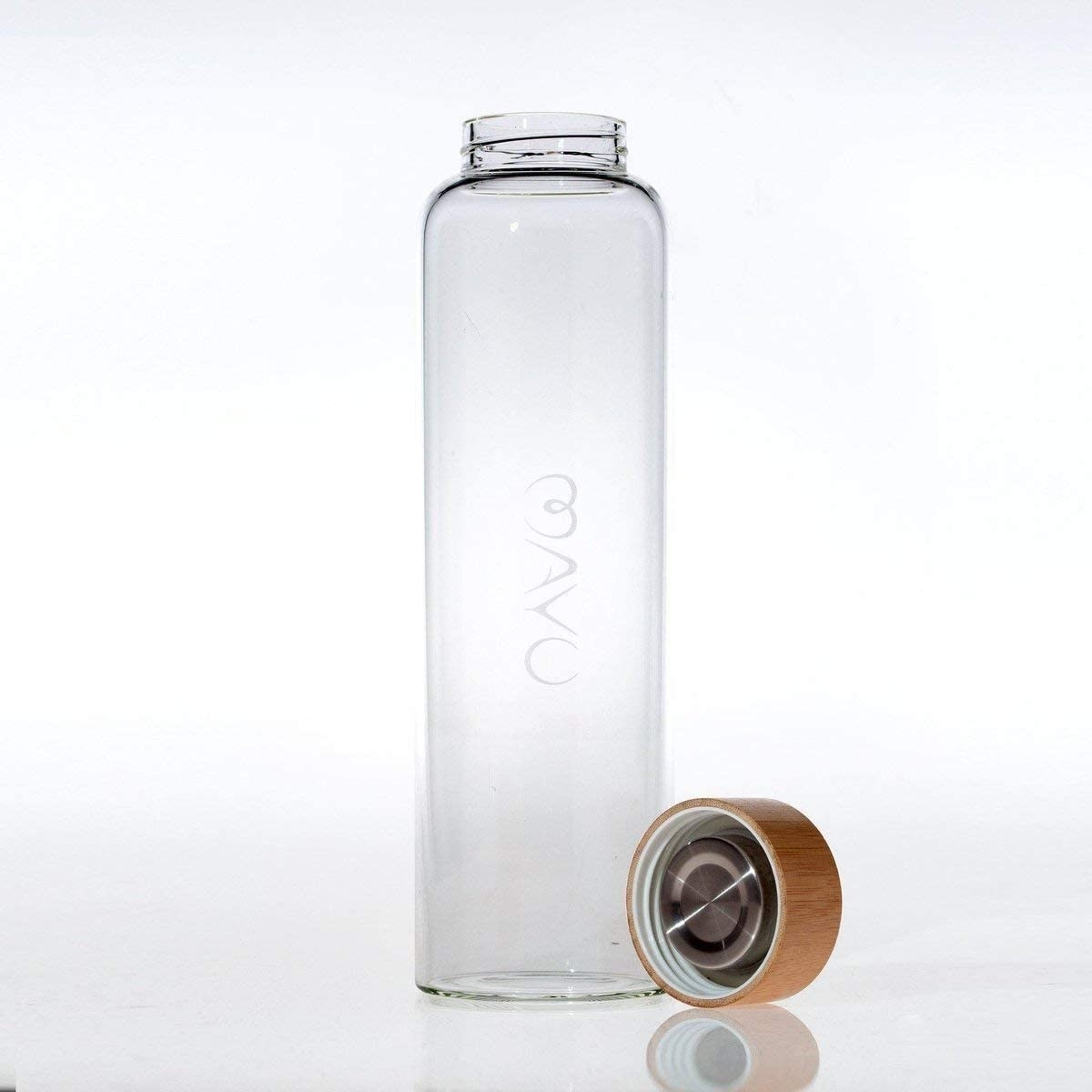 The Mayu water bottle next to its bamboo top.