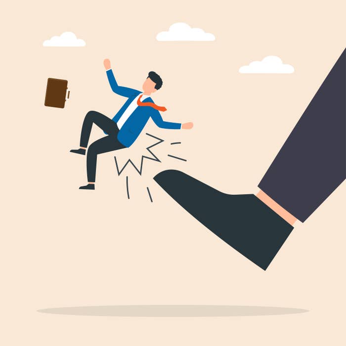 Man being kicked by boss