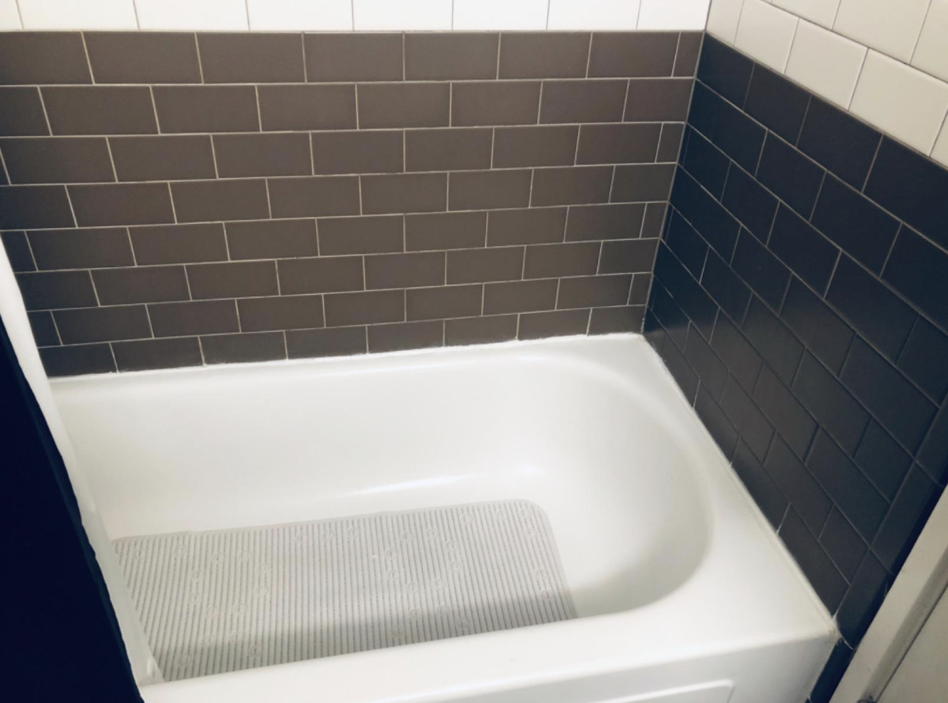 A reviewer&#x27;s tub caulked with the product