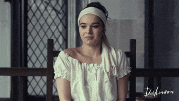 A gif of Emily getting a bucket of water tossed on her in Dickinson