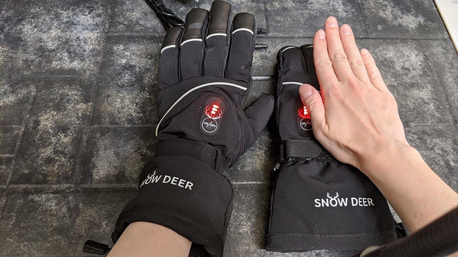 reviewer wearing electric heated gloves