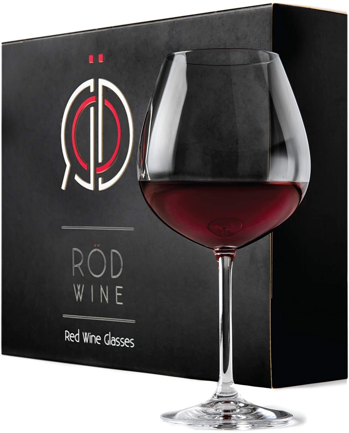 A RÖD wine glass filled with red wine set in front of the box it comes in.
