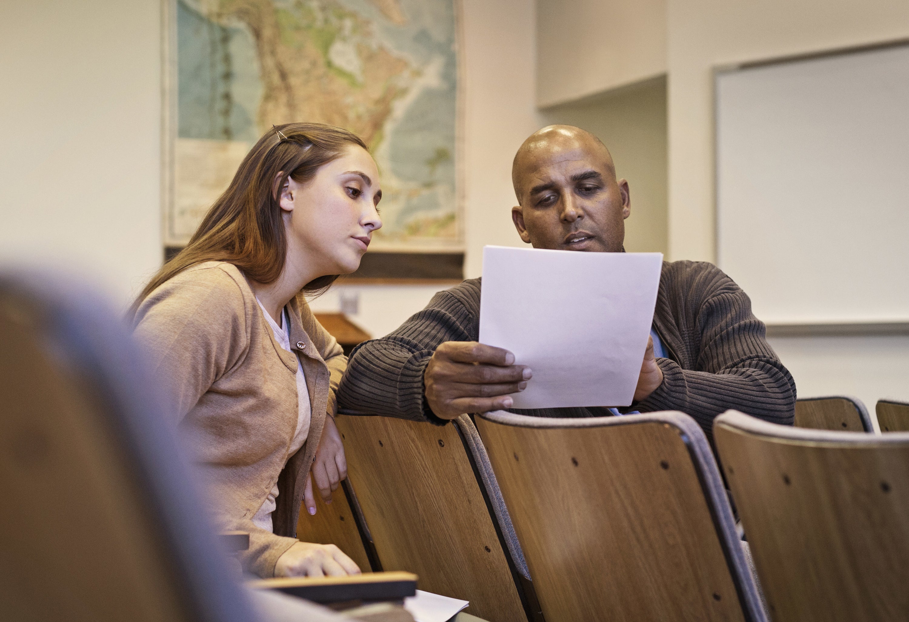 TA and professor discussing a paper