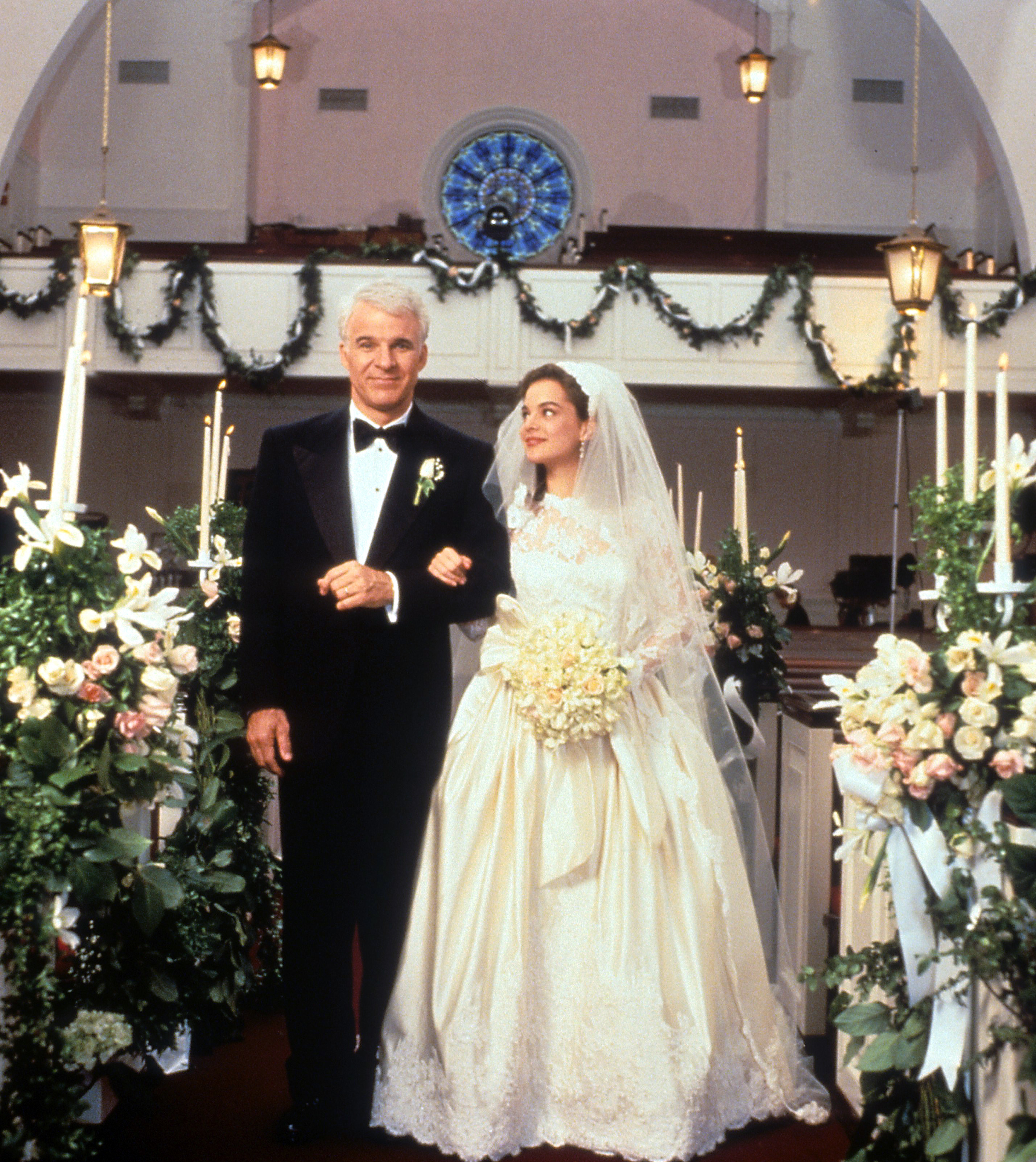 Actor Steve Martin walks down the aisle with Kimberly Williams-Paisley in a scene from  Father Of The Bride.