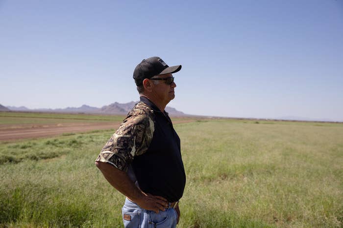 A man with a cap in a field 