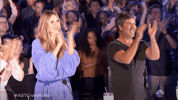 Gif of Heidi Klum and Simon Cowell clapping on &quot;America&#x27;s Got Talent&quot;