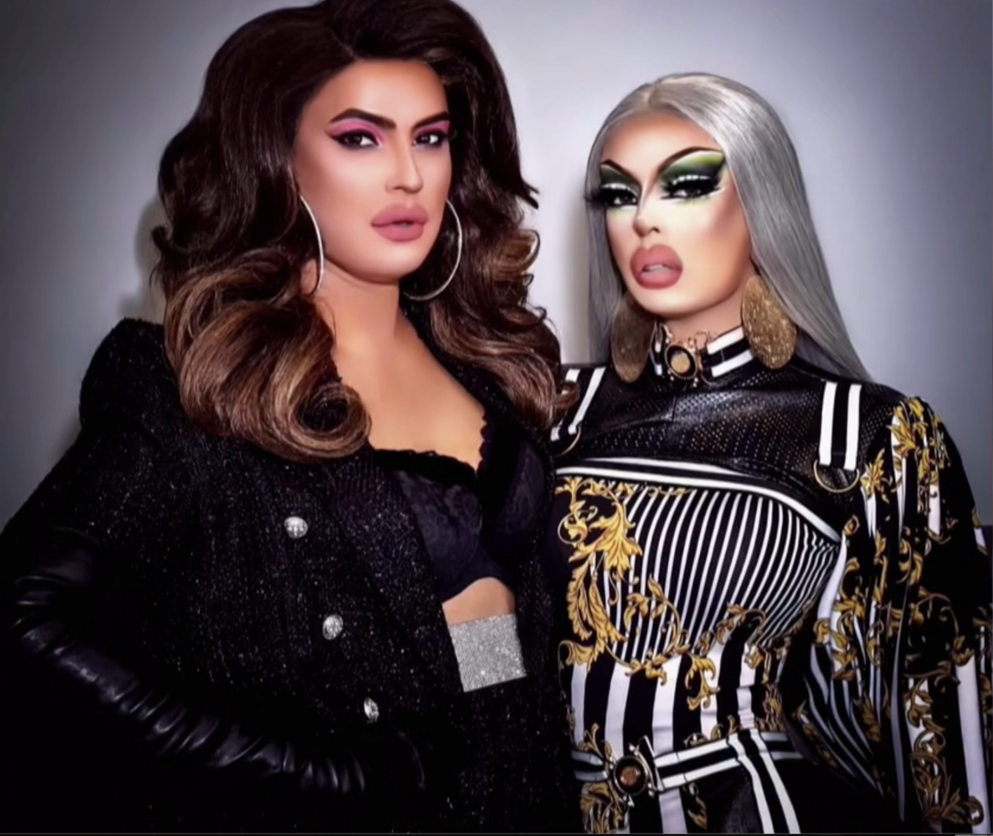 two drag queens standing next to each other