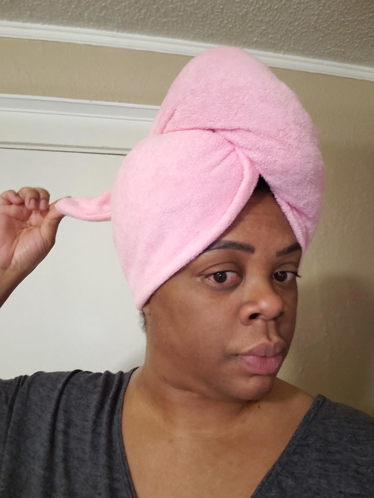 A reviewer wearing a pink Turbie Twist