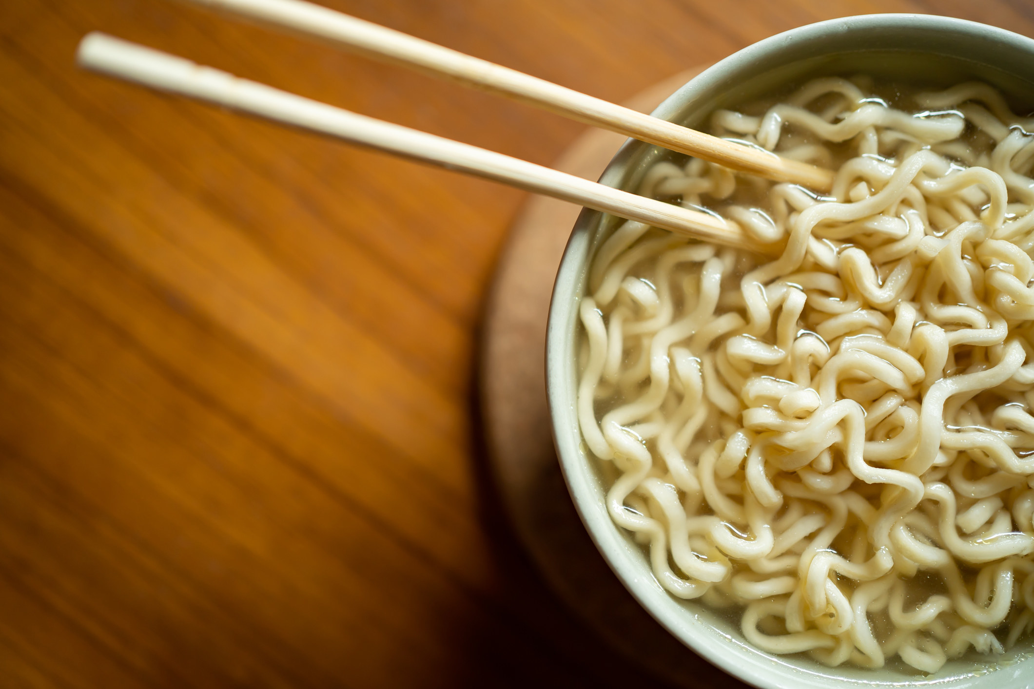 Instant ramen noodles and chopsticks.