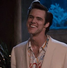 Ace Ventura points and gives a thumbs up