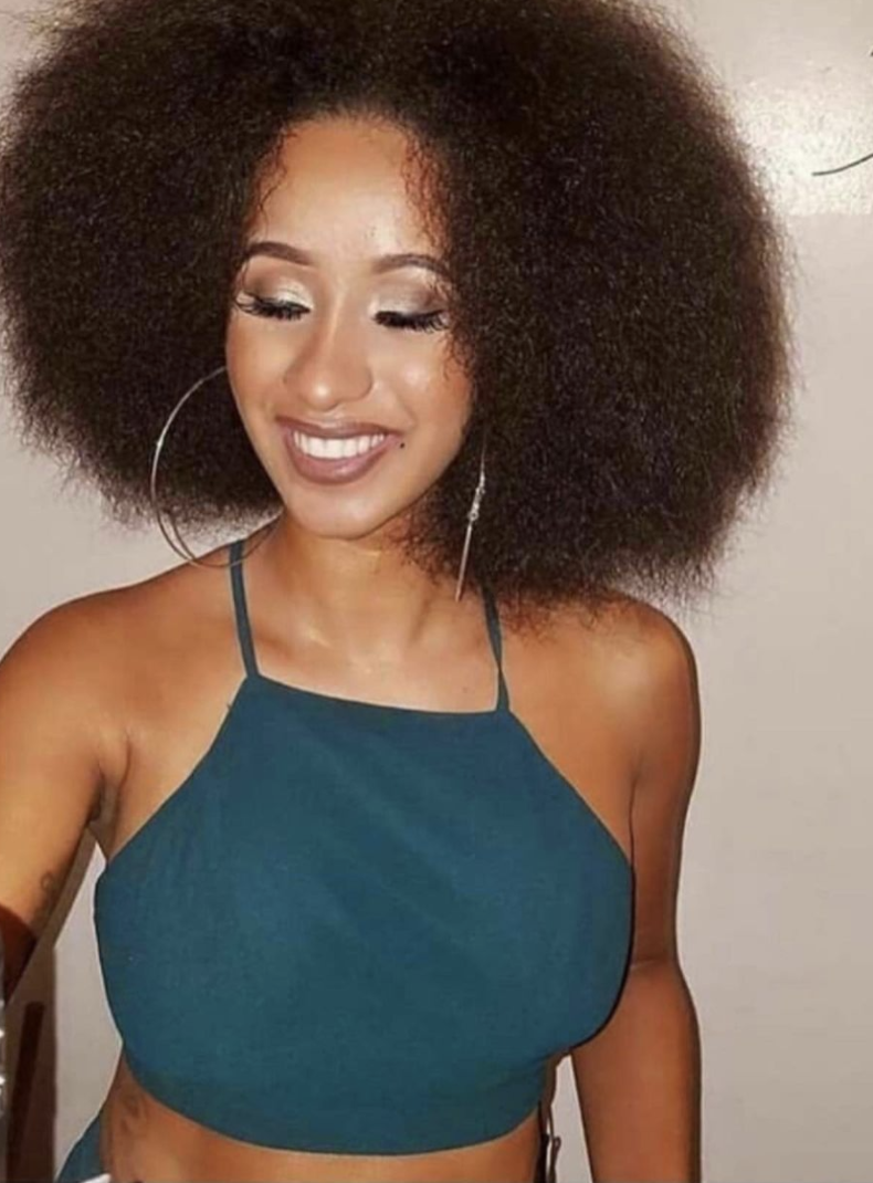 A younger Cardi rocking her natural hair