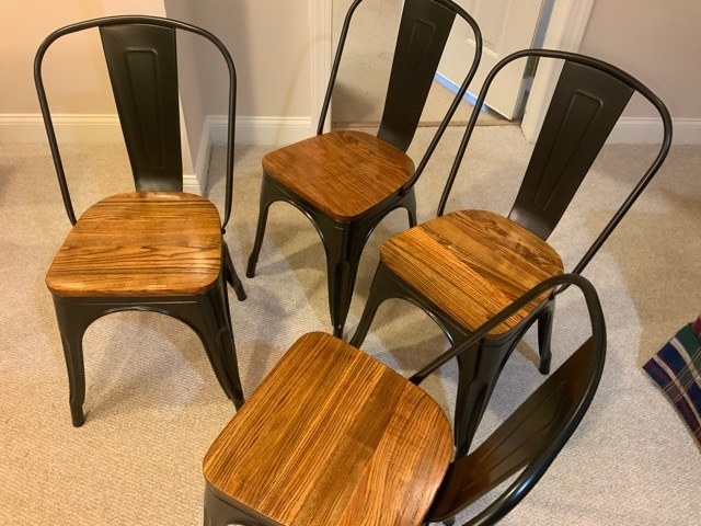 four metal and wood chairs
