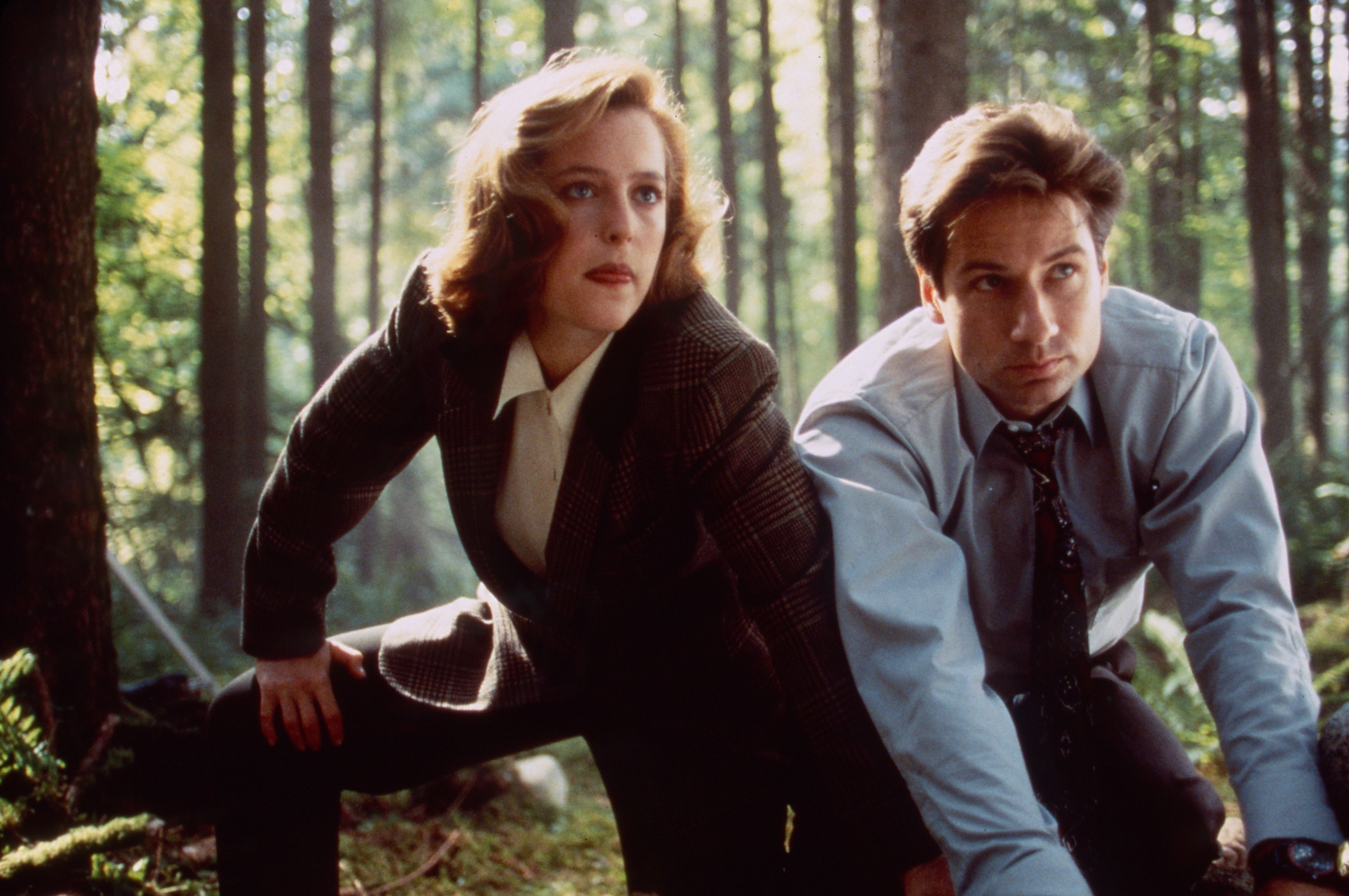 Agents Mulder and Scully in the woods